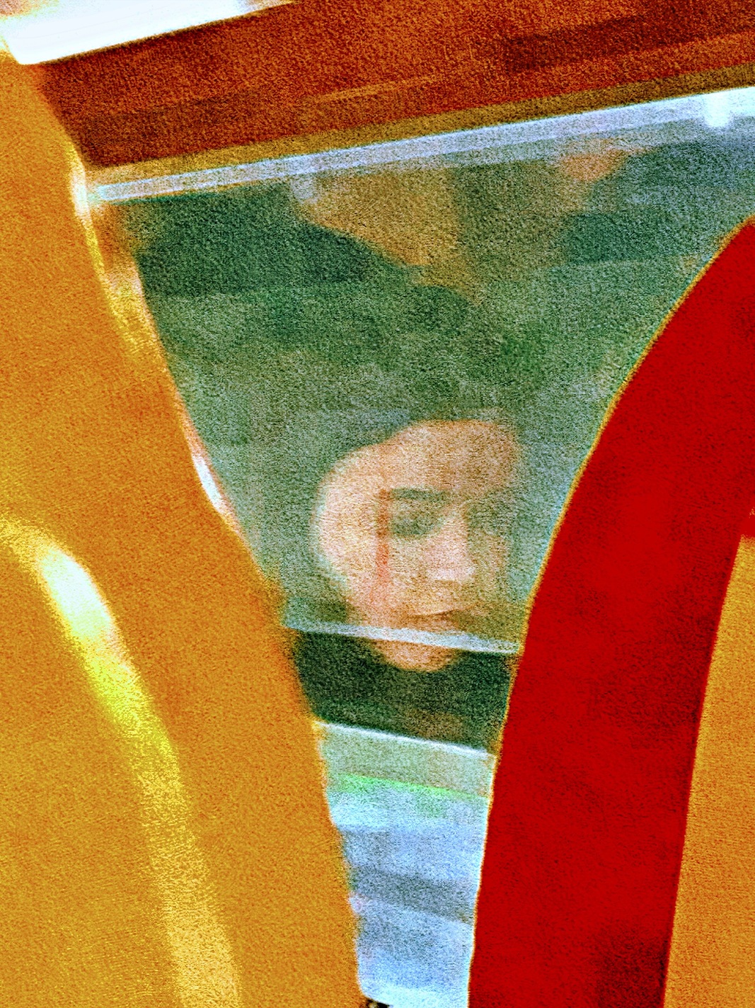 A woman reflected in a train window