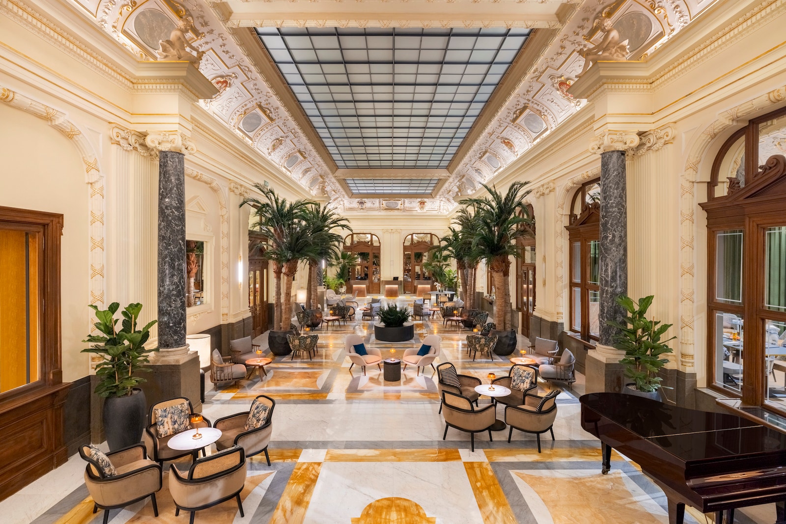 NH Collection Prague Carlo IV Lobby and reception empty overview palm trees piano